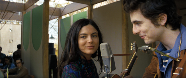 Still from A Complete Unknown - Monica Barbaro as Joan Baez and Timothée Chalamet as Bob Dylan