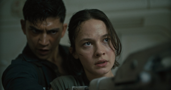 Still from Alien: Romulus: Cailee Spaeny as Rain Carradine, Archie Renaux as Tyler