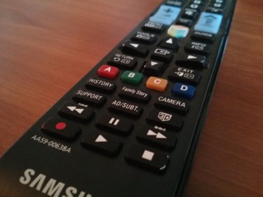 A photo of a Samsung Smart TV remote control